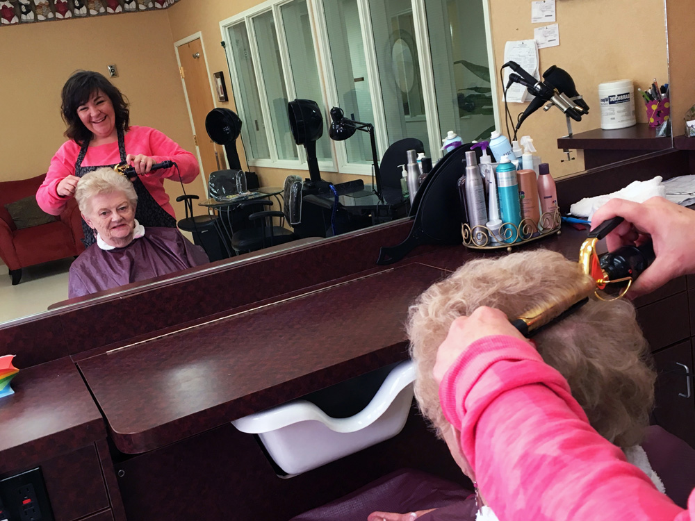 Lady Getting Hair Treatment at Our Barber Shop